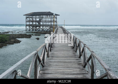 Old wooden planks jetty pier ocean water ripples Stock 