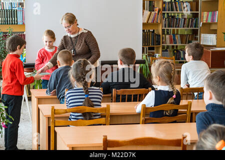 CHAPAEVSK, SAMARA REGION, RUSSIA - JANUARY 31, 2018: School kids of elementary school in the classroom with a female teacher Stock Photo