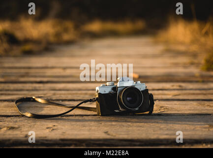 Vintage Camera on a wood path Stock Photo