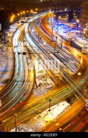 Light trails of cars passing on a busy crossing in Helsinki, Finland Stock Photo