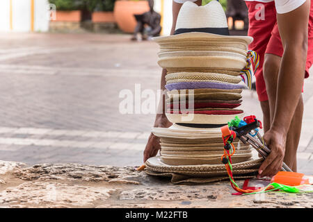 Seller of hats with many hats on his head, on a beach in Lima - Peru Stock  Photo - Alamy