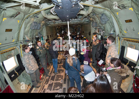 Families of U.S. Airmen with the 424th Air Base Squadron, and of U.S. Soldiers assigned to the 39th Signal Battalion, visit Santa's C-130J Super Hercules aircraft, on Chièvres Air Base, Dec. 21, 2017. Airmen with the 37th Airlift Squadron, 86th Airlift Wing, were performing a training flight with the 86th Aeromedical Evacuation Squadron. (U.S. Army Stock Photo