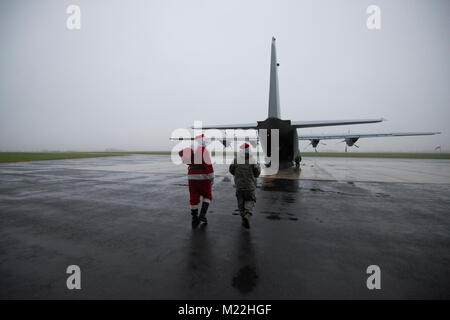 Families of U.S. Airmen with the 424th Air Base Squadron, and of U.S. Soldiers assigned to the 39th Signal Battalion, visit Santa's C-130J Super Hercules aircraft, on Chièvres Air Base, Dec. 21, 2017. Airmen with the 37th Airlift Squadron, 86th Airlift Wing, were performing a training flight with the 86th Aeromedical Evacuation Squadron. (U.S. Army Stock Photo