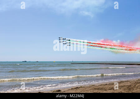 Frecce Tricolori (Tricolour Arrows) - Airshow exhibition over Grado beach, Italy Stock Photo