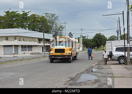 Yellow city bus in Guabito (Panama) on the border to Costa Rica Stock Photo