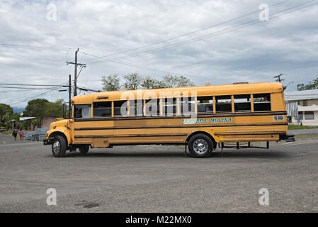 Yellow city bus in Guabito (Panama) on the border to Costa Rica Stock Photo