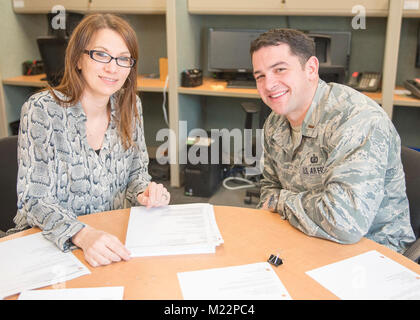 102nd Intelligence Wing Installation Deployment officer 2nd. Lt. Christian Dinoia discusses logistics plans with 102nd Intelligence Wing Support Agreement Manager Melissa Jackson at Otis Air National Guard Base on Joint Base Cape Cod, Mass. Stock Photo