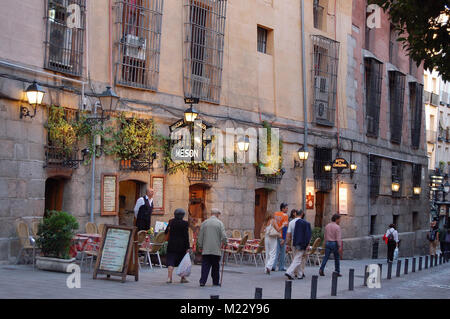 Passersby in front of the Meson Rincon de la Cava tapas restaurant off Plaza Mayor - Madrid, Spain Stock Photo