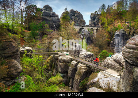 Magical hiker trails with interesting high cliffs and green forest, famous Bastei bridge in Germany, Dresden, Saxon Switzerland, Europe Stock Photo