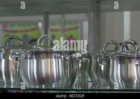 Set of new metal pans near close up. Stock Photo