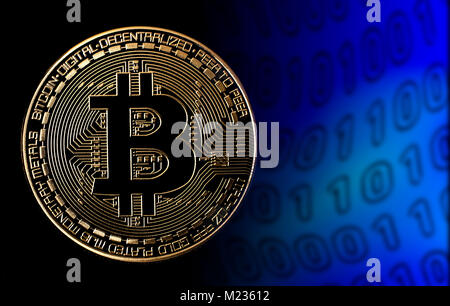 bitcoin on black background and binary code Stock Photo