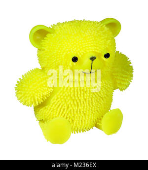 Bright yellow puffer stress ball teddy bear cat toy isolated on a white background Stock Photo