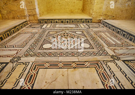 ALEXANDRIA, EGYPT - DECEMBER 17, 2017:  The stone mosaic on the floor of historic mosque in Qaitbay Fort with scenic geometric patterns, on December 1 Stock Photo
