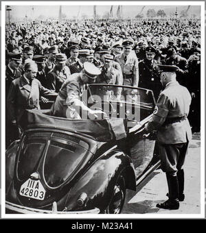 1930's ADOLF HITLER with DR. PORSCHE at the launch of 'the people's car' KDF VW Volkswagen Beetle prototype convertible air-cooled motorcar at Fallersleben Wolfsburg Germany May 1938 Stock Photo