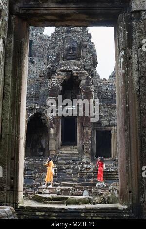 Chinese girls visiting Bayon Temple, Angkor, Cambodia Stock Photo