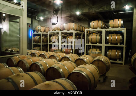 Wooden barrels use to store Japanese wine produced in wineries on Furano, Hokkaido. Furano Winery is open to the public and includes free wine tasting Stock Photo