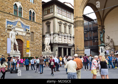 FLORENCE, ITALY - SEPTEMBER 16, 2017: Busy square Piazza della Signoria in front of the Palazzo Vecchio in Florence; the main point of the origin and  Stock Photo