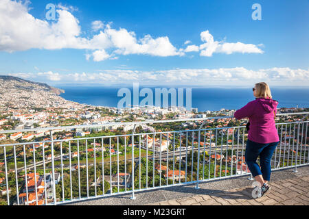 madeira portugal madeira Pico dos Barcelos female tourist looking at view of Funchal the bay port harbour and old town Funchal Madeira Portugal Europe Stock Photo