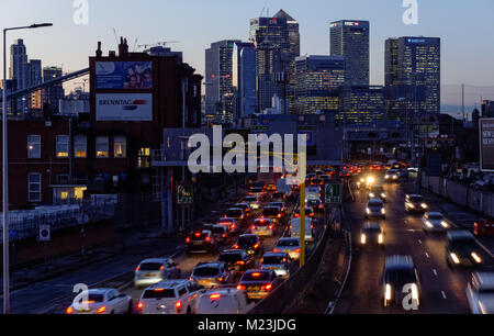 Traffic on A102 Blackwall Tunnel Approach with Canary Wharf skyscrapers in the background, London England United Kingdom UK Stock Photo