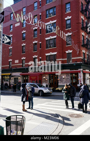 Welcome to Little Italy sign hanging at the intersection of Mulberry street and Broome Street.Lower Manhattan.New York City.USA Stock Photo