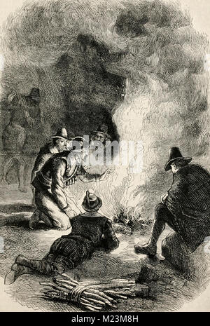 Pilgrim Fathers round a watch fire Stock Photo