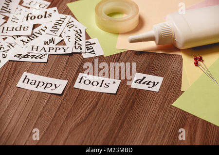 Happy Fools Day phrase on wooden background Stock Photo