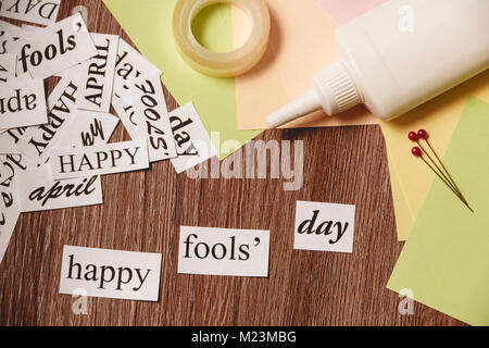 Happy Fools Day phrase on wooden background Stock Photo