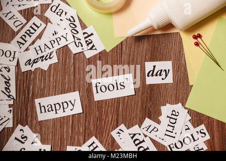 Happy Fools Day phrase on wooden background Stock Photo