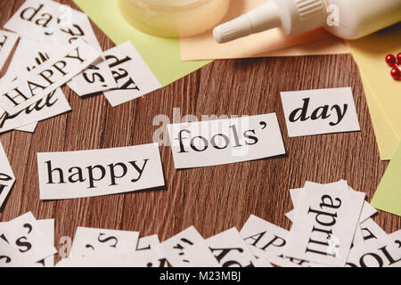 Happy Fools Day phrase on wooden background Stock Photo
