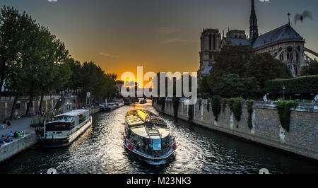 Peniche boat in Paris at sunset on the Seine river Stock Photo