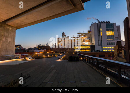 The High Line promenade illuminated at twilight surrounded by modern ...