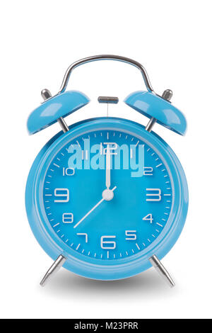 Blue alarm clock with the hands at 12 am or pm midnight or noon isolated on a white background, One of a set of 12 images showing the top of the hour  Stock Photo