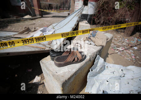 Sanaa, Yemen. 04th Feb, 2018. Shoes lie on the debris of a Houthi rebels-held criminal research building, which was destroyed in an alleged Saudi-led air strike in Sanaa, Yemen, 04 February 2018. Credit: Hani Al-Ansi/dpa/Alamy Live News Stock Photo