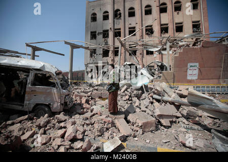 Sanaa, Yemen. 04th Feb, 2018. A Yemeni man inspects the damage caused by an alleged Saudi-led air strike against a Houthi rebels-held criminal research building in Sanaa, Yemen, 04 February 2018. Credit: Hani Al-Ansi/dpa/Alamy Live News Stock Photo