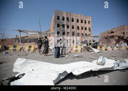 Sanaa, Yemen. 04th Feb, 2018. Yemeni men inspect the damage caused by an alleged Saudi-led air strike against a Houthi rebels-held criminal research building in Sanaa, Yemen, 04 February 2018. Credit: Hani Al-Ansi/dpa/Alamy Live News Stock Photo