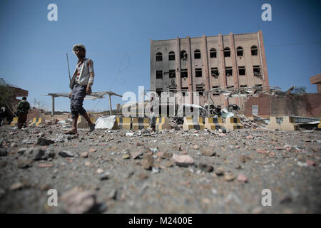 Sanaa, Yemen. 04th Feb, 2018. Yemeni men inspect the damage caused by an alleged Saudi-led air strike against a Houthi rebels-held criminal research building in Sanaa, Yemen, 04 February 2018. Credit: Hani Al-Ansi/dpa/Alamy Live News Stock Photo