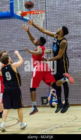 Brentwood, Essex, 4th February 2018 Aubrey Dube (center) of Sussex Bears and Caleb Tabnar (right) scramble for the ball at the Basketball match at Brentwood credit Ian Davidson/Alamy Live News Stock Photo