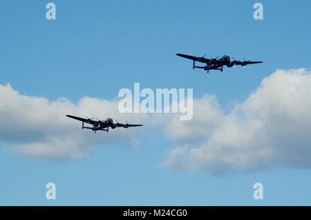 The Battle of Britain Memorial Flight with the Last Two Airworthy Avro Lancaster Bombers, Thumper and Vera. Dawlish Air Show, Devon, UK. Stock Photo