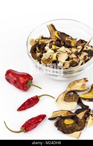 https://l450v.alamy.com/450v/m24dh8/dried-mushrooms-and-chili-peppers-on-a-white-background-aromatic-food-m24dh8.jpg
