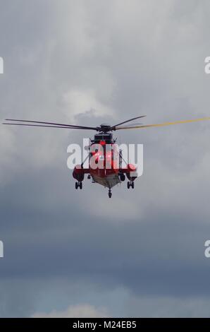 Ace of Clubs Royal Navy Sea King Rescue Helicopter Displaying at Dawlish Air Show, Devon, UK. Summer, 2015. Stock Photo