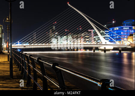 Samuel Beckett Bridge at night by the architect is Santiago Calatrava, is a cable-stayed bridge in Dublin that joins Sir John Rogerson's Quay on the s Stock Photo