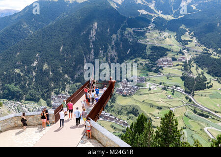 A group of tourists admiring the view of the Valira d'Orient in the Pyrenees Mountains from the Mirador Roc del Quer viewpoint, Canillo, Andorra Stock Photo