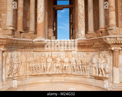 Roman ruins of Sabratha theater stage detail with Roman and Sabratha figures Stock Photo