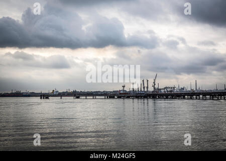 The oil jetty at Hamble, Southampton with Fawley Oil Refinery in the distance Stock Photo