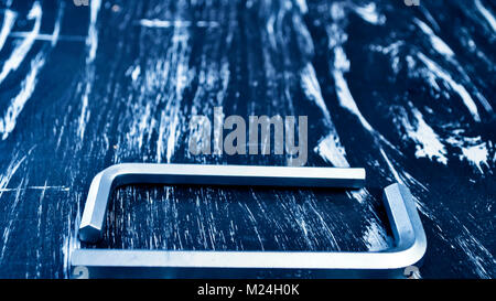 Hexagon for repair work lying on the table. Repair tools Stock Photo