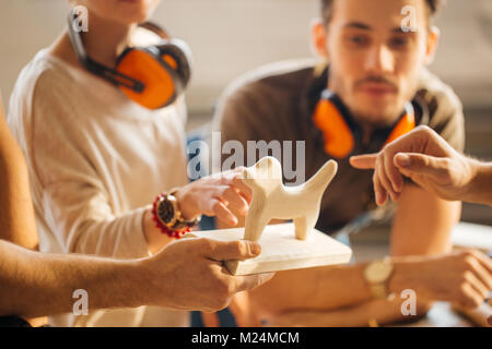 carpenter with students in woodworking workshop Stock Photo