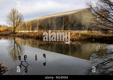 Supermarket shopping trolley dumped in Walsall canal in the Midlands Stock Photo