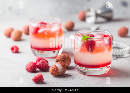 Cold lychee and raspberry cocktail Stock Photo