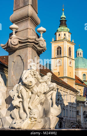 Town Square with Robba Fountain also known as the Fountain of the Three Carniolan Rivers with the Cathedral in the background, Ljubljana, Slovenia Stock Photo