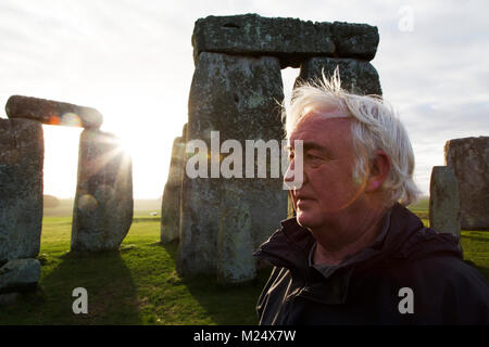 Tourguide Pat Shelley at the Stonehenge stone circle in Wiltshire, England. The ancient monument dates from the Neolithic era, around 5,000 years ago. Stock Photo